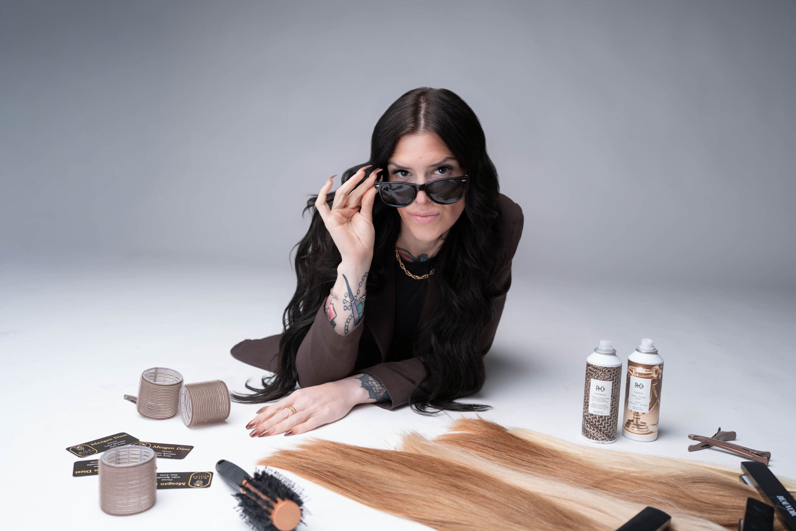 Hair artist with extension wefts and tools