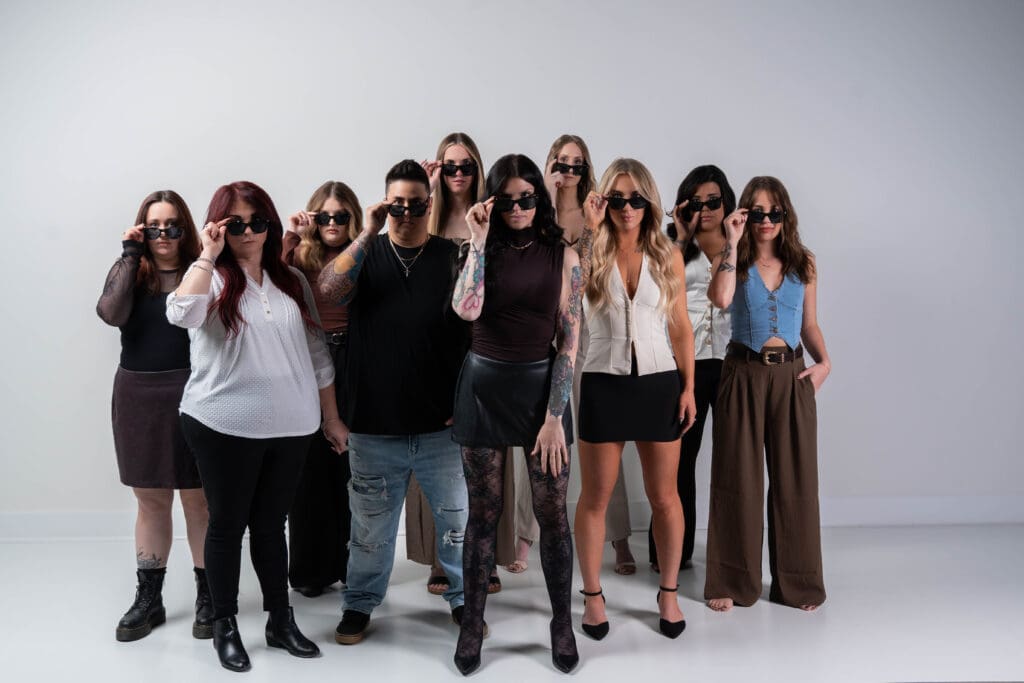 The Wild Roots Hair Co. team lowering their sunglasses